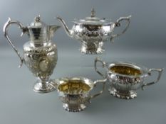 A GOOD BRITANNIA METAL THREE PIECE TEASET having foliate scroll and gadrooned decoration and a non-