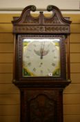 A 19th CENTURY CARVED OAK ROLLING MOON LONGCASE CLOCK by Thomas Lister, Halifax, the single glazed