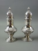 TWO PIERCED LIDDED PEPPER POTS, classical form on circular stem base, Sheffield 1903, 3.2 troy ozs