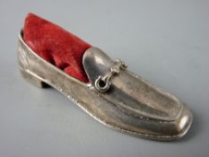 A SILVER PIN CUSHION in the form of a gentleman's slip on shoe, London 1983, maker's mark 'A N'