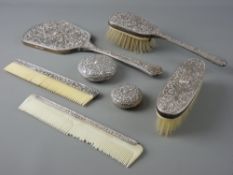 A SEVEN PIECE SILVER DRESSING TABLE SET, stamped '800 Deluxe', comprising hand mirror, two brushes