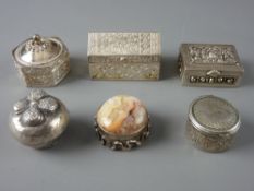 SIX SILVER & WHITE METAL PILL BOXES, one in casket form, all with various decoration, one stamped '