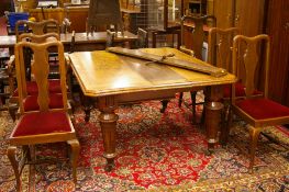 AN EXCELLENT QUALITY LATE EDWARDIAN OAK & CROSSBANDED OBLONG WIND-OUT DINING TABLE
