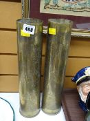 A pair of decorated brass artillery shells