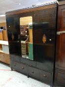 A vintage polished wardrobe with centre mirror & two base drawers