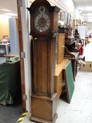 A vintage oak encased grandmother clock with three chimes