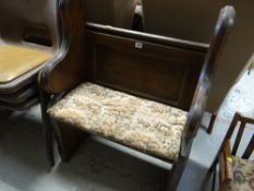 A small pitch pine pew with floral motif