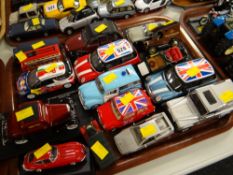 A collection of unboxed iconic Diecast cars including Mini & Citroen 2CV etc