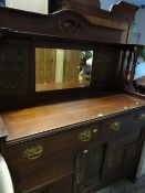 An early twentieth century mirror backed sideboard with metal Art Nouveau handles circa 1910