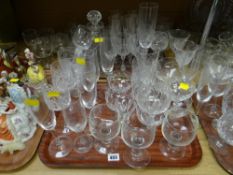 A quantity of drinking glasses including circular based decanter