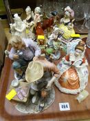Sundry figurines including an Indian carved figurine, Goebel etc