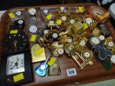 A parcel of novelty miniature bedroom clocks with display case
