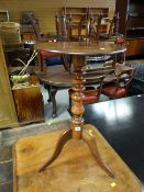 An antique circular topped tripod occasional table