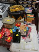A collection of vintage shop items & tins etc