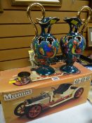 A boxed Mamod model steam roadster together with a pair of continental jugs, measuring cup