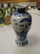 A late nineteenth century Chinese blue & white baluster vase with scene of figures & wildlife (