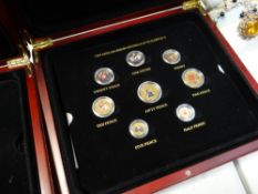 Two wooden cased sets of coinage 'The Emblem Series Decimals of Elizabeth II'