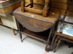 A drop leaf oak vintage two-tier tea trolley