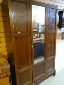 A vintage mirrored single-door wardrobe