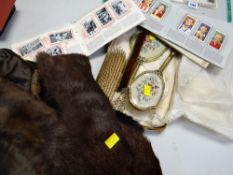 Various fur stoles, a dressing table set & a collection of albumed cigarette cards