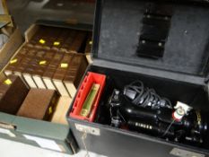 A cased vintage electric sewing machine & a quantity of Dickens novels E/T