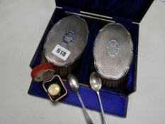 A cased set of silver backed brushes & comb together with two silver spoons & a cased watch dial