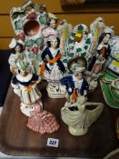 Various Staffordshire flat backs including mantel clock, glass dome, figurines etc