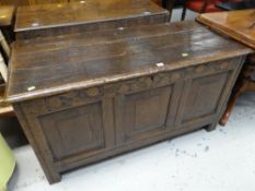 An early nineteenth century carved oak coffer chest with inscribed initials SLI