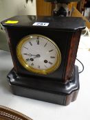 A slate & marble mantel clock with circular face & Roman numerals