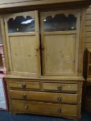 A good pine kitchen dresser having a base of two long & two short drawers with an enclosed semi-