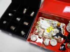 Collection of silver thimbles together with a Limoges miniature cabinet set etc
