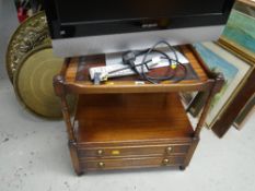 A Bevan Funnell Reprodux two-drawer leather topped mahogany TV stand