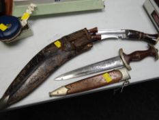 A Third Reich WWII (or style) dagger together with a kukri knife set