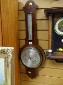 A vintage mahogany aneroid barometer