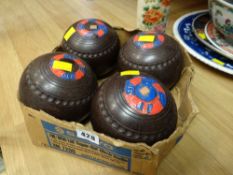 A set of four Yatton bowling club bowls