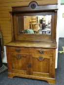 A turn of the century oak mirror back sideboard of small proportions