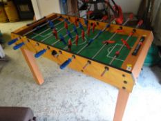 A floor-standing table-football game
