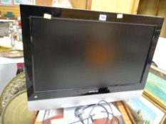 A Polaroid HD flatscreen TV & remote control E/T