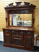 A turn of the century mirror back mahogany sideboard with carved facade & substantial metalwork