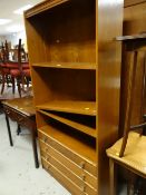 A modern wooden shelving unit with drawers