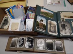 A good album of vintage loose postcards & an album old photographs
