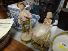 A Royal Dux figure - male carrying a pitcher together with a Royal Vienna figure - a cherub
