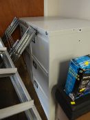 A pair of four-drawer metal filing cabinets