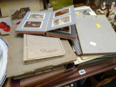 A quantity of early to mid twentieth century black & white still photographs, mainly in albums, some