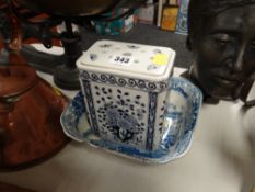 A blue & white pottery dish together with another blue & white Japanese decorated lidded vase
