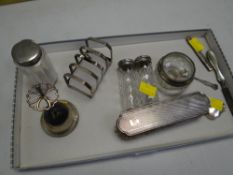 A parcel of mixed silver / part-silver items including hat pin stand, toast rack & brush