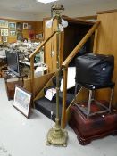 An antique brass three-branch telescopic standard lamp E/T