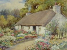 WARREN WILLIAMS ARCA watercolour - thatched cottage in a colourful garden, signed, 21 x 31cms