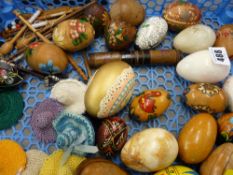 Quantity of porcelain and treen eggs, bobbins, thimbles etc