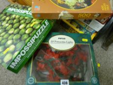 Parcel of boxed jigsaws, decorative lights etc